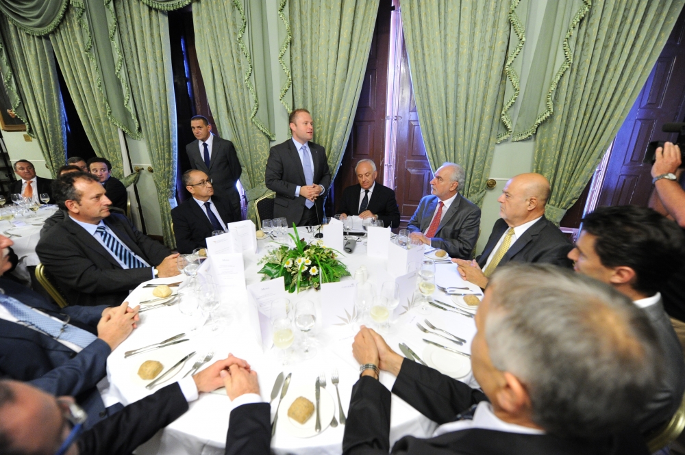 Joseph Muscat addressing the Chamber of Commerce, which is among those opposed to the proposed American University site at Zonqor Point