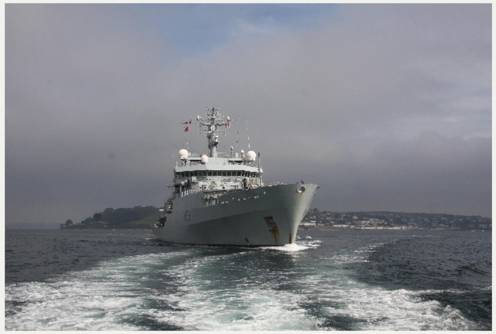 People are being taken to HMS Enterprise by boat as it awaits offshore. 