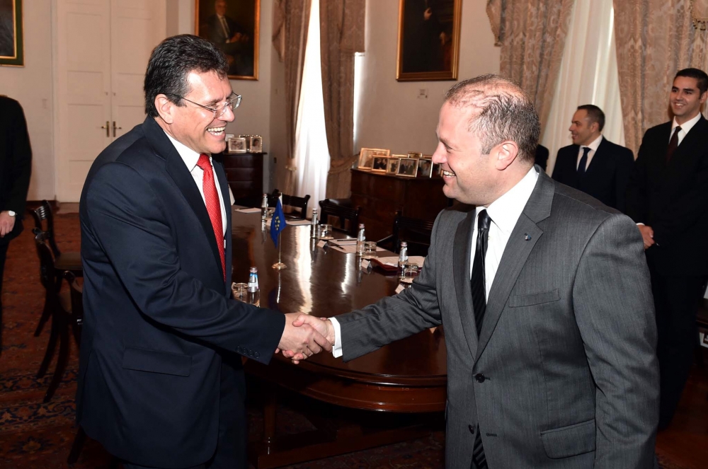 Maros Šefčovič (left) is greeted by Prime Minister Joseph Muscat