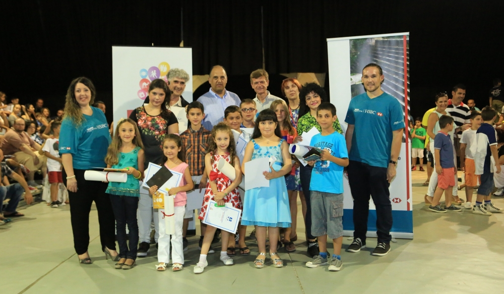 Young winners of the Catch the Drop Art Competition together with (from left) HSBC representative Noelita Ellul Scerri, artist Al Valenti, Expo Events Sales Co-ordinator Gunther Micallef Decesare, Glenn Bugeja, Anna Maria Gilson, and HSBC representative Daniel Grech Avellino.