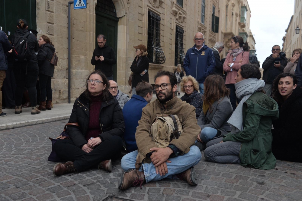 Activists stage a sit-in outside Castille in solidarity with Graffitti activists who are inside the Office of the Prime Minister staging a sit-in protest