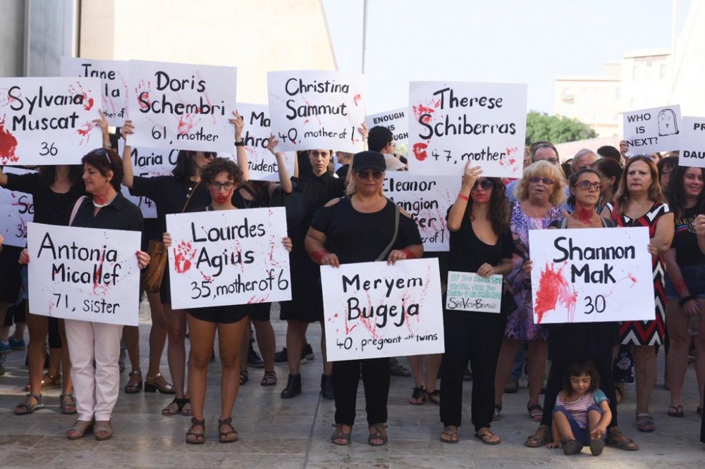 A number of people at the demonstration were holding placards with the names of Malta's victims of domestic violence. (Photo: James Bianchi/MediaToday)