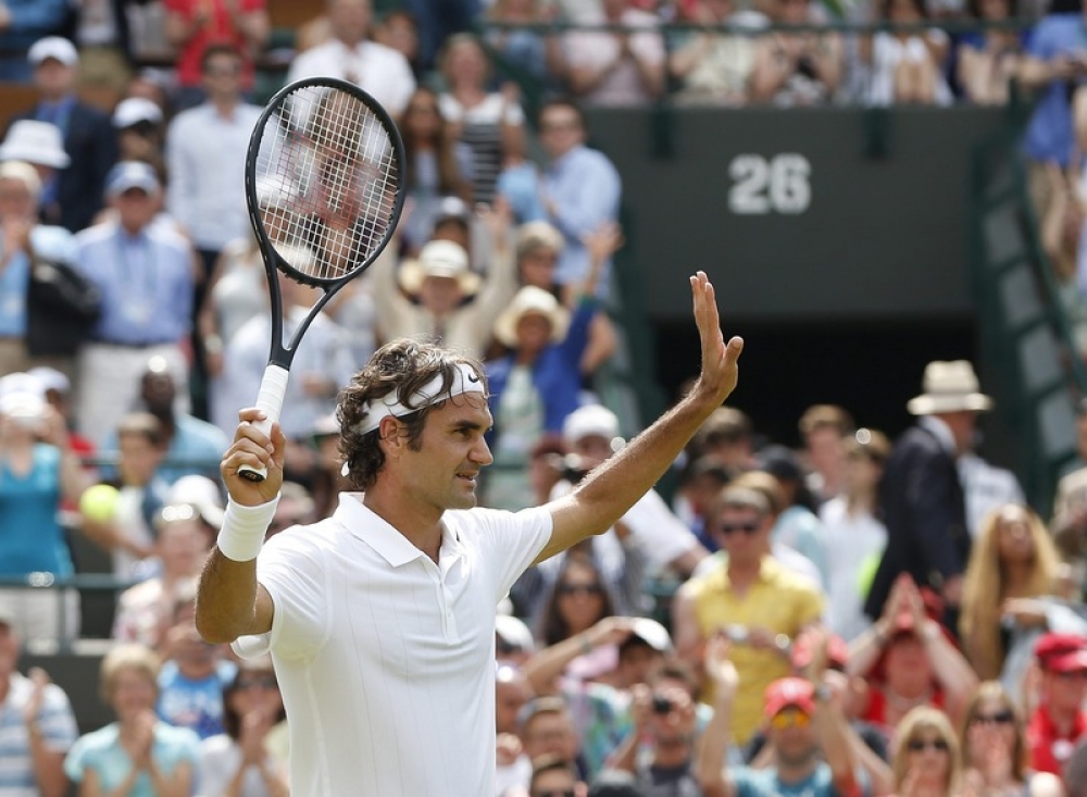 Roger Federer of Switzerland celebrates his win over Paolo Lorenzi of Italy during their first round match at Wimbledon. Photo by EPA/VALDRIN XHEMAJ