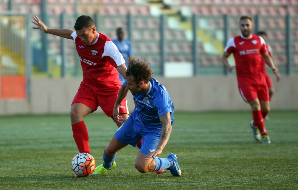 Manolito Micallef of Pembroke attempting to clear the ball from Lydon Micallef’s feet. Photo: Dominic Borg