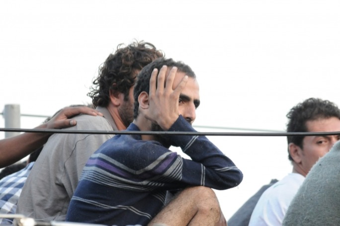 File photo of Lampedusa survivors: a Syrian asylum seekers who travelled to the Netherlands without a passport has now been imprisoned for six months in Malta for leaving the country illegally.