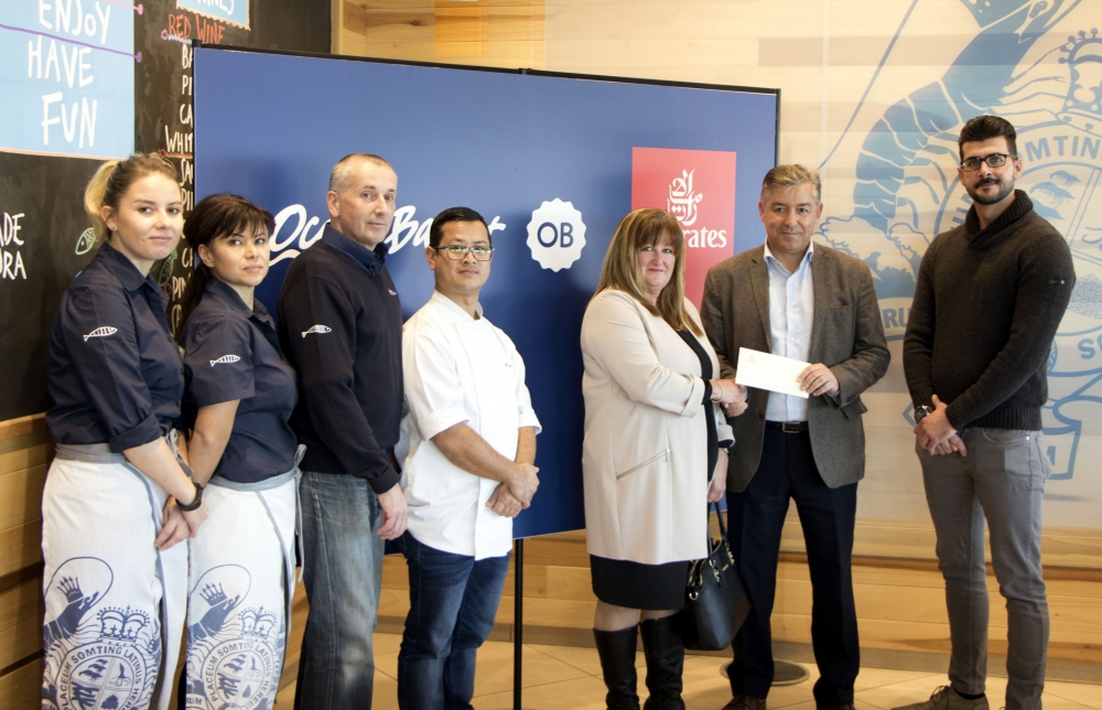 Picture shows Carmen Borg (fifth from left) receiving her prize in the presence of (from left) Zhaneta Katrishka (Ocean Basket Front of House Manager), Iskra Stefanova (Ocean Basket Kitchen Manager), Jon Smith (Ocean Basket Operations Manager), Maheshwor Shrestha (Ocean Basket Sushi Chef), Paul Fleri Soler (Emirates Manager Malta) and Daniel Borg