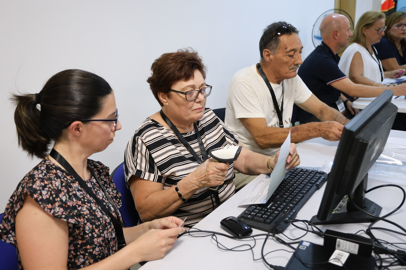 Party functionaries verifying voter eligibility and distributing ballot papers during Wednesday's early voting session (Photo: PN)