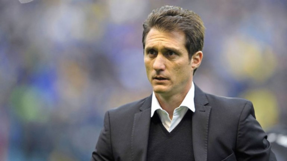 Boca manager Guillermo Barros Schelotto leaves after Copa Libertadores loss