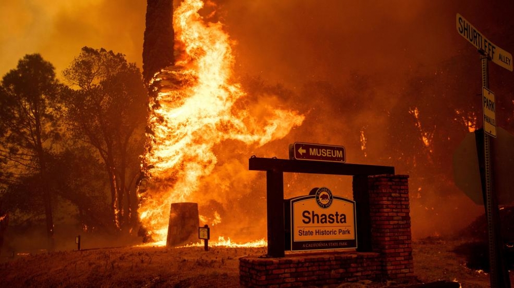 California firestorms leave 2 dead and thousands homeless