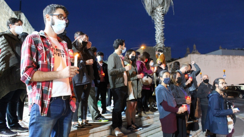 Activists lit up candles, while reading out the names of all 14 prisoners who lost their lives at Corradino Correctional Facility