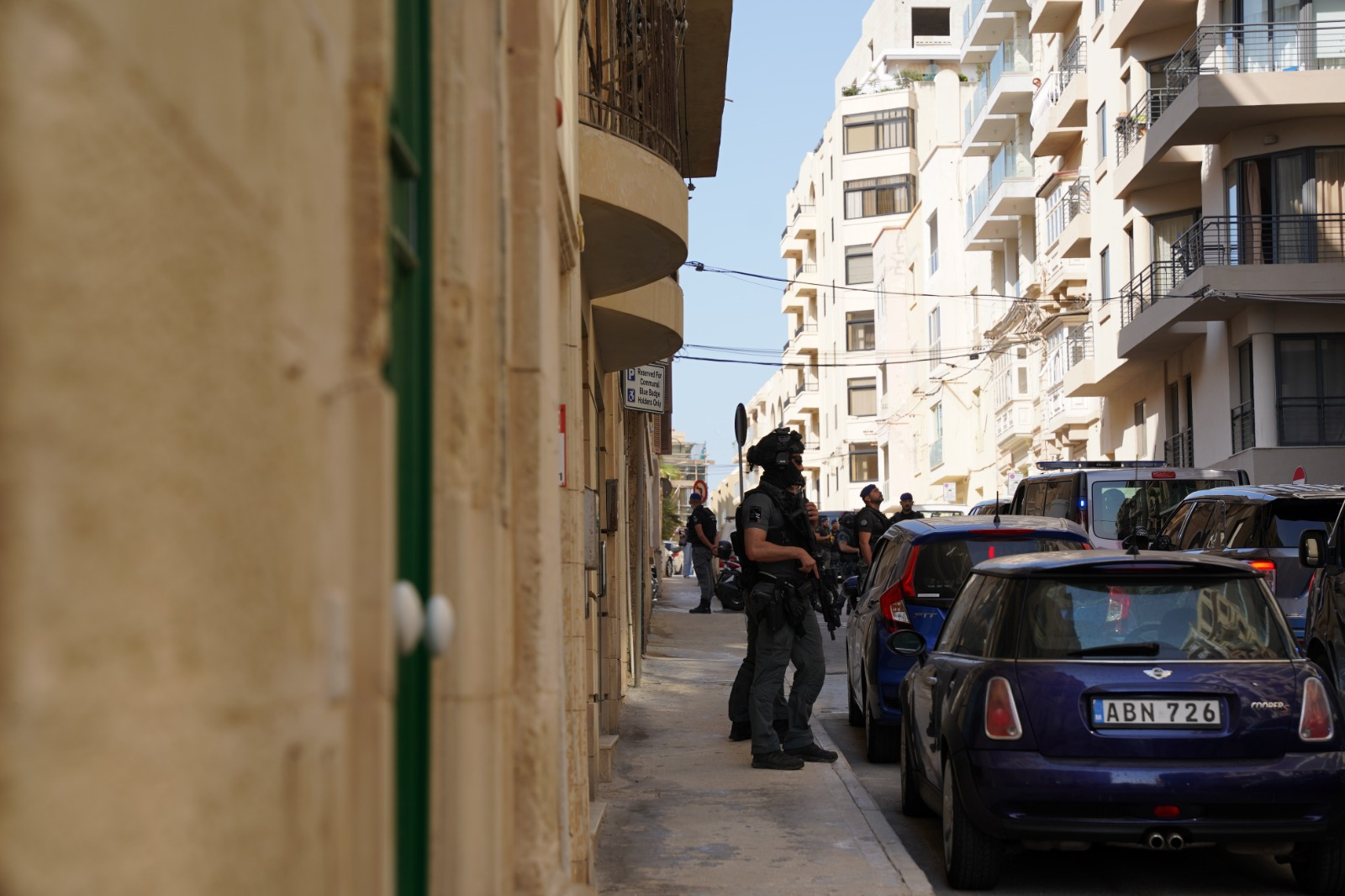 People passing through Locker Street had to be escorted by police during the site visit (Photo: Juliana Zammit/MaltaToday)