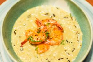 Spicy prawns on a bed of rice and cranberries with coconut curry