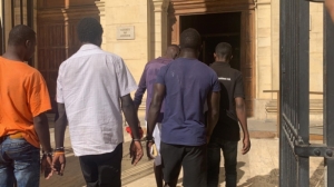 Parading of migrants under arrest into court ‘institutionalised racism’, NGOs say