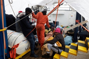 Blankets, socks, shoes and supplies delivered to stranded migrant rescue ship