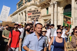 Anti-vaxxers, right-wing and Christian evangelists rail against ‘global vaccine experiment’
