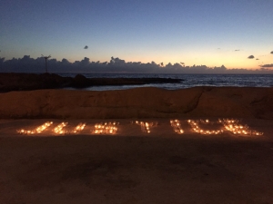 Candles on Sliema beach spell out ‘justice’, 10 months from Caruana Galizia assassination