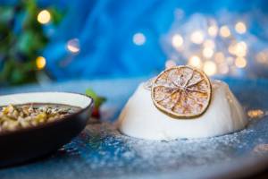 Spice infused pannacotta with chocolate sauce and roasted chestnuts