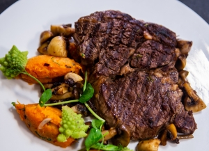 Rib-eye steak with sweet potatoes and mushrooms