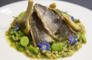 Broad bean kusksu with artichokes al cartoccio, fennel sauce and pan fried Bogue fish