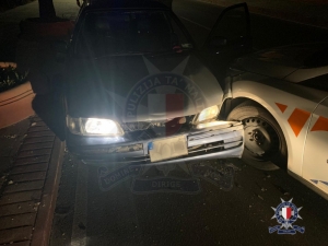 Youth crashes into police vehicle, tries to escape