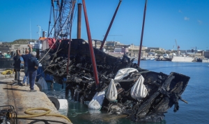 Burnt yacht wreckage recovered from seabed