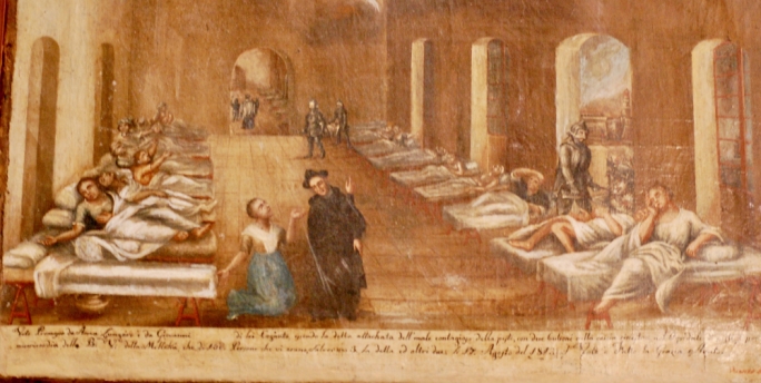 An ex-voto of the Plague of 17 Aug 1813 of Anna Lungaro showing the pest Hospital Valletta. The light house on Fort st Elmo can be seen through the arch where an attendant with a mask around his face is fumigating the foul air. (Sanctuary Our Lady of Mellieha)