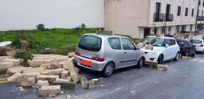 Parked cars along walls and trees were pummelled