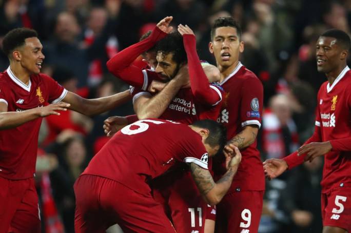 Mohamed Salah being mobbed after a brilliant goal