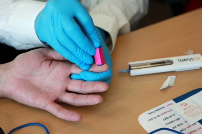 Crew practicing to take blood glucose levels using the Tempus IC