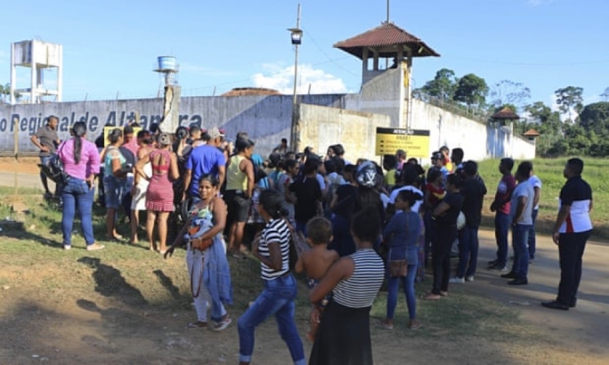 People seek information about family members who are prisoners after a riot inside the Regional Recovery Center in Altamira, Brazil