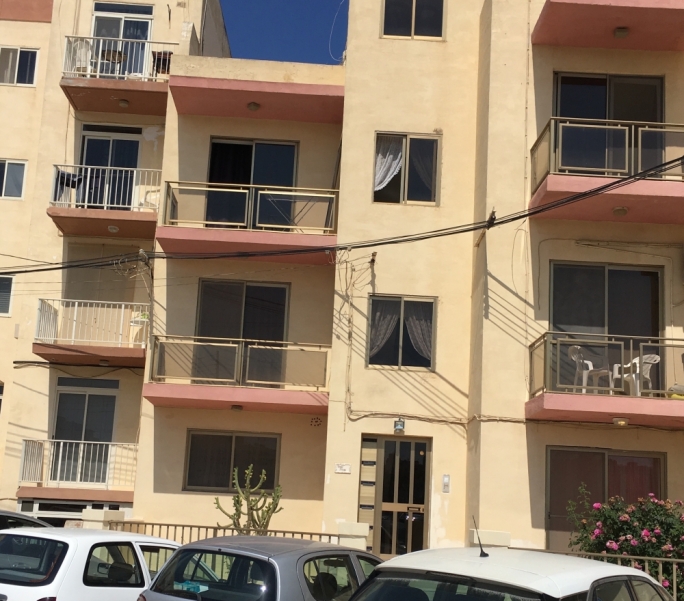 Nobody answered apartment 5 of this cheap-looking Qawra holiday flat. But 'high net worth individual' Victoria Shopina is registered on this address