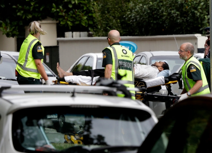 Police Commissioner Mike Bush said four suspects were in custody, three men and a woman