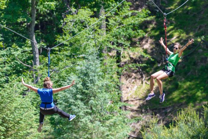 Travel from tree to tree like a monkey at one of the treetop adventure parks outside the city
