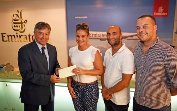 Emirates Malta manager Paul Fleri Soler presenting the gift vouchers to Alexandra Vella in the presence of Daniel Chircop and Sander Aguis