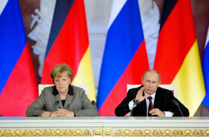 Merkel (left) accused Moscow of trying to make countries in the western Balkans economically and politically dependent on Russia in order to gain influence there.
