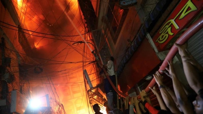 The flames raced through four adjoining buildings, which were also used as chemical warehouses