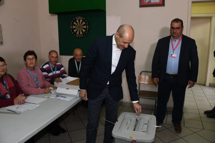 Chris Fearne casting his vote at the Fgura party club