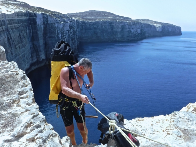Haston starts his day making his way down the cliff. Photo: http://steviehaston.blogspot.com.mt
