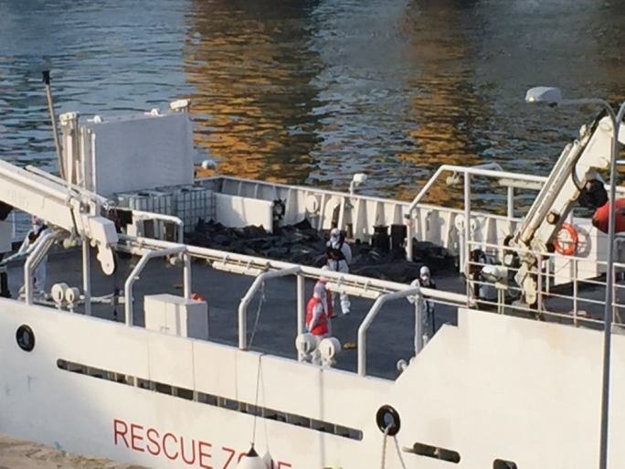 Body bags on the decks of the Bruno Gregoracci coast guard vessel