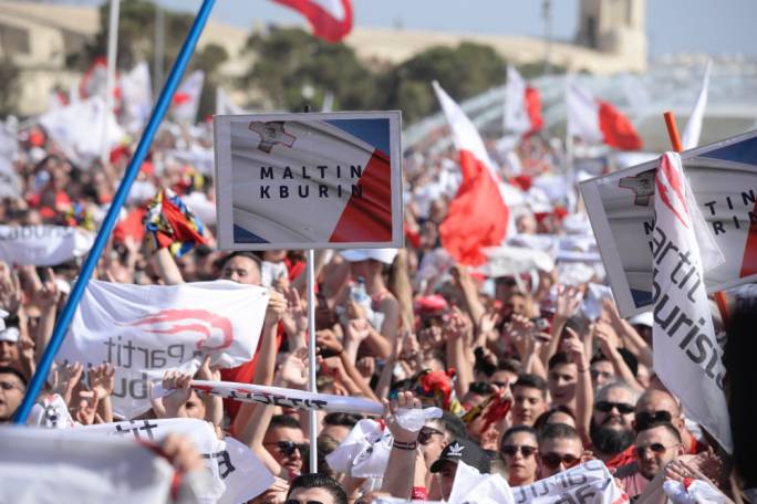 People are sporting placards with the words 'Proud Maltese' (Photo: James Bianchi/MediaToday)