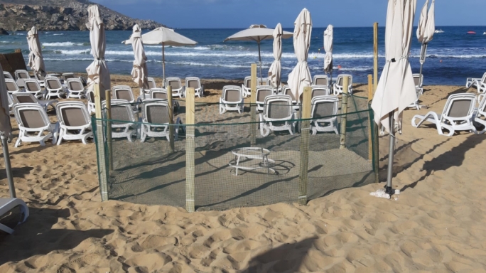 In a more quiet part of the beach managed by the neighbouring hotel, the enclosure for the eggs is smaller