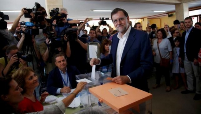 Spain's acting prime minister and People's Party leader Mariano Rajoy casts his vote