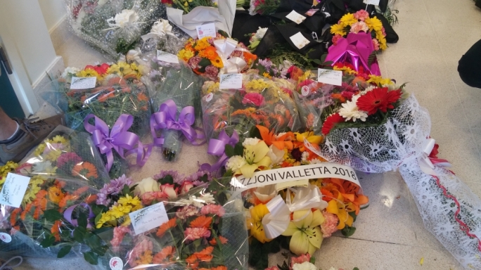Flowers left for the victims of the recent tragedy, which claimed the lives of some 700 migrants the mortuary