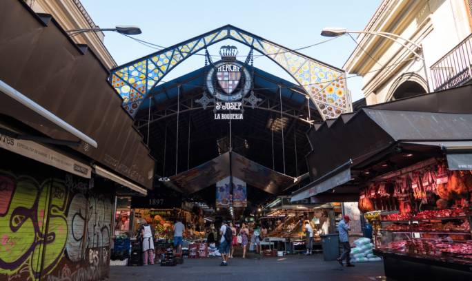 The market La Boqueria is jam packed with permanent stalls selling fresh fruit and veg, cold meats, cheeses, olive oils and fish and also has plenty of spots to indulge in tapas and cold beers