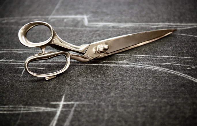 Woman in the dock over cab holdup using scissors