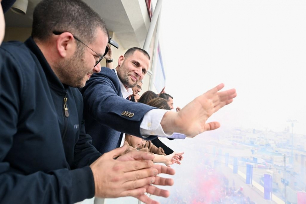 Robert Abela waving to Labour Party supporters outside the Hamrun headquarters after winning the 2022 general election (Photo: Ray Attard/MaltaToday) 