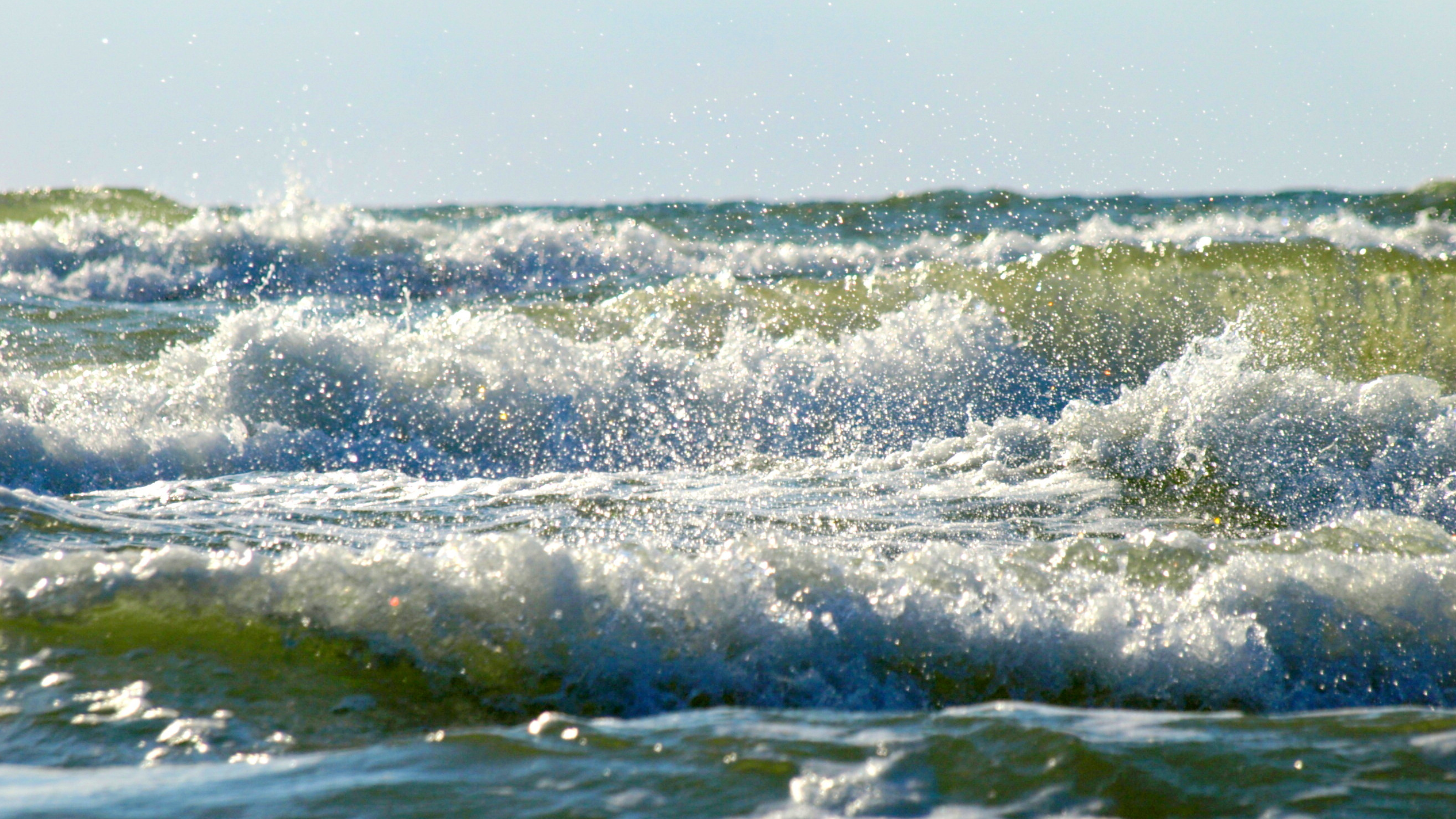 Man dies after falling into strong waves while working on boat