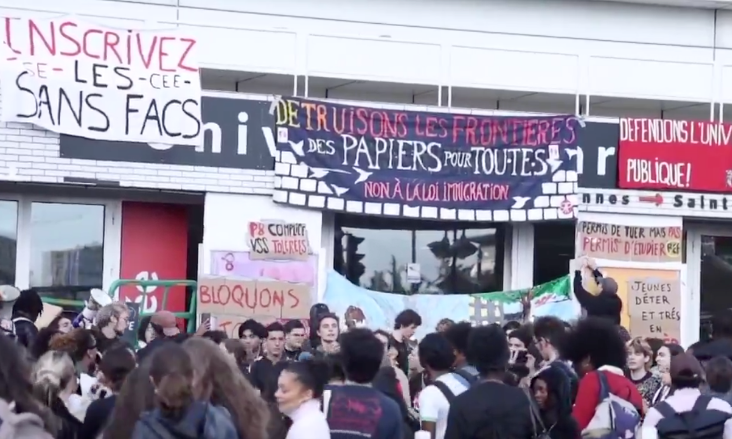Banners reading 'Allowed to kill, but not to study' and 'Defend public universities'