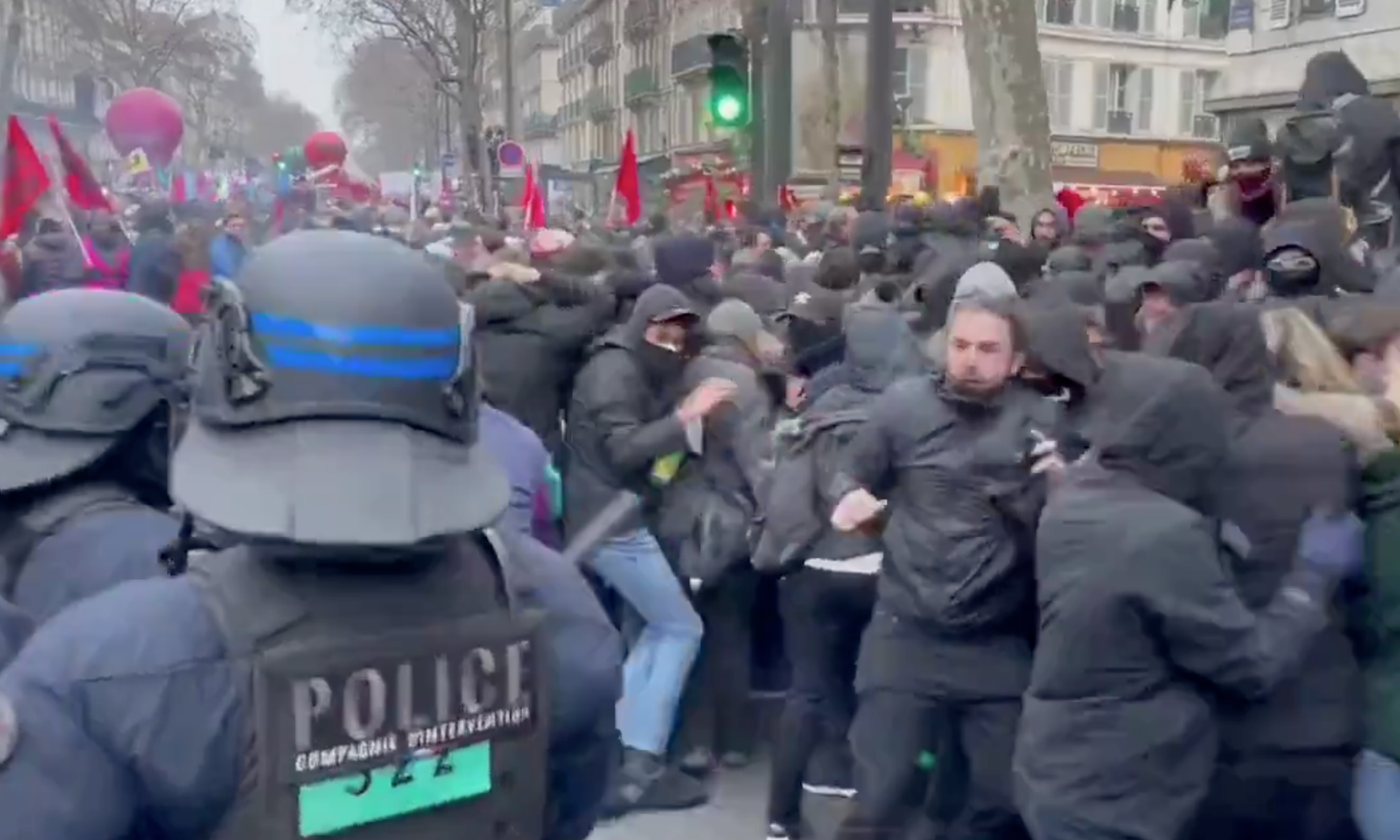 An officer was filmed holding a girl in a headlock during protests