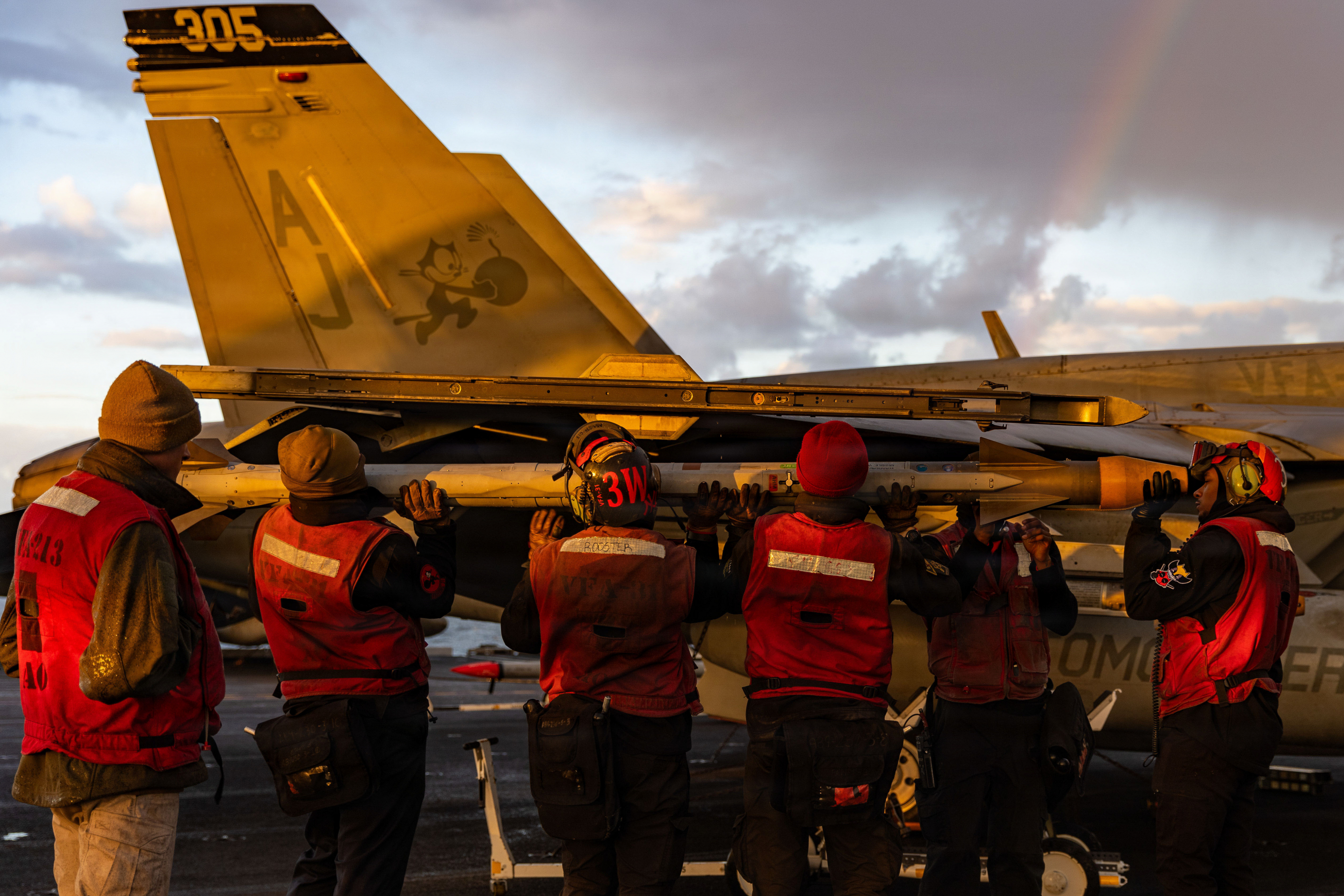 U.S. Sailors load ordnance onto an F/A-18E Super Hornet aircraft, attached to Strike Fighter Squadron 31, on the flight deck of the world’s largest aircraft carrier, USS Gerald R. Ford (CVN 78), while supporting Operation Epic Fury (Photo: U.S. Navy)